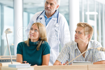 Medical students with professor in classroom