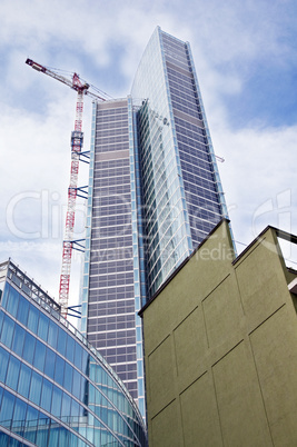 Modern building and old house contrast