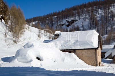 alpine house in the snow