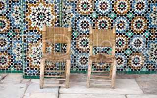 Two chairs on tiles background