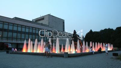 time lapse. At night near a fountain.