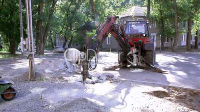 tractor prepares a building site.