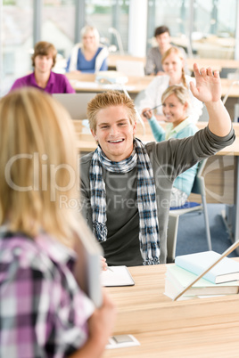 High school student raising hands