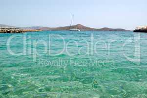 Turquoise Aegean Sea near beach of luxury hotel with yacht view,