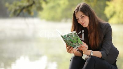 The girl reads the book