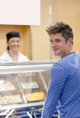 customer standing in a cafeteria