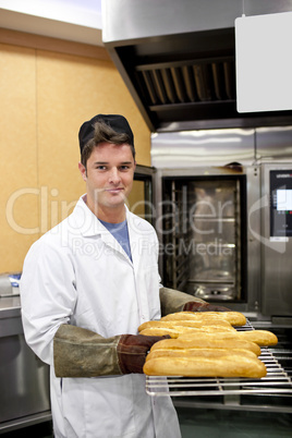 baker showing his baguettes