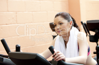 woman training on a bicycle in a fitness center