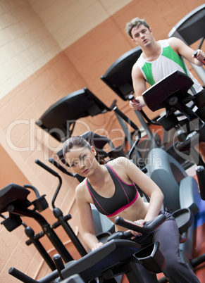 people doing exercises using equipments in a sport