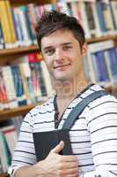 student holding a book