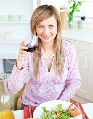 woman eating salad in the kitchen