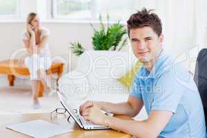 man using his laptopwith his girlfriend