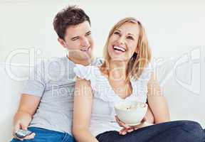 couple watching a movie with popcorn