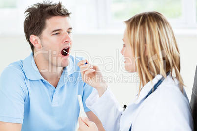 doctor taking a saliva sample of a patient