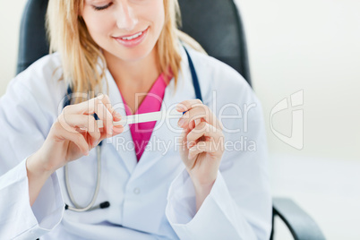 female doctor looking at temperature results