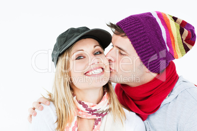 woman receiving a kiss from her boyfriend