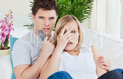 couple watching a horror movie