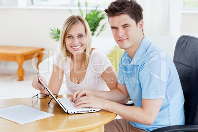 couple working together on the laptop