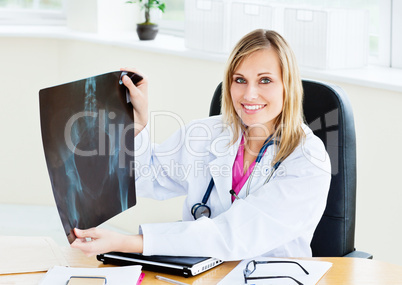 female doctor showing an x-ray