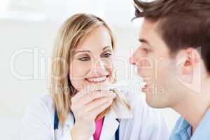 female doctor taking a saliva sample