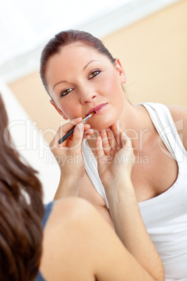 Make-up artist applying some lipstick
