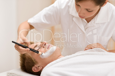 Male cosmetics - facial mask in salon