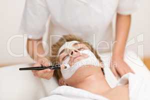 Male cosmetics - facial mask in salon
