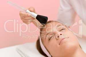 Luxury facial care - woman in spa salon