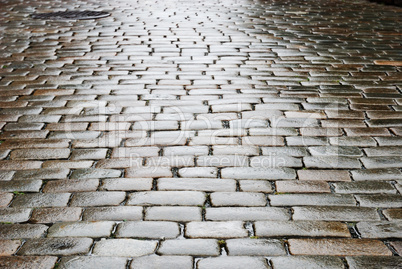 Wet block-stones of sett paving