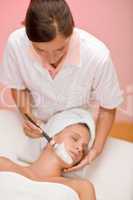 Facial mask - woman at beauty salon