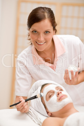 Facial mask - woman at beauty salon