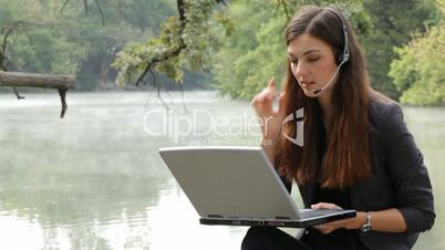 The girl with the laptop on the nature