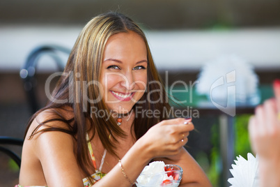 smiling girl eating ice scream