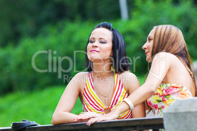 two talking girls in the park