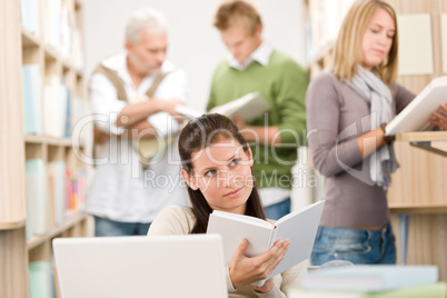 High school library - Student with book