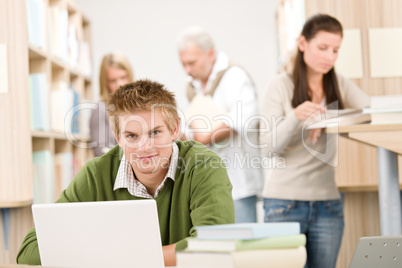 High school library - Student with book