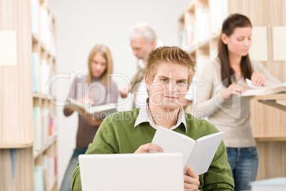 High school library - Student with book