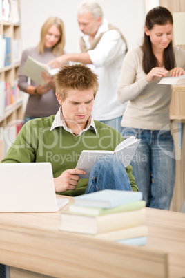 High school library - Student with book