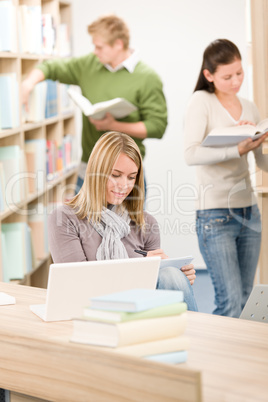 High school library - student with laptop