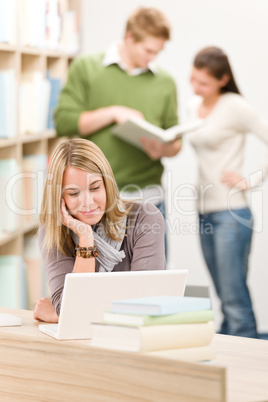 High school library - student with laptop