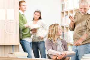 High school library - student with professor