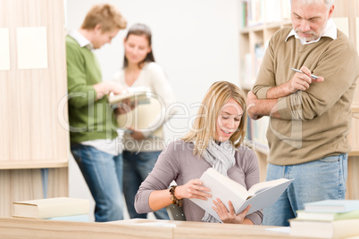 High school library - student with professor