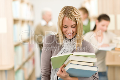 High school library - happy student with book