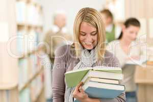 High school library - happy student with book