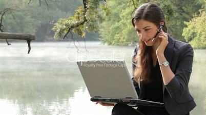 The girl with the laptop on the nature