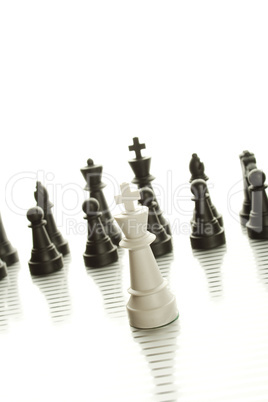 White King and Black ArmyWhite King in the foreground against a background of black army chips