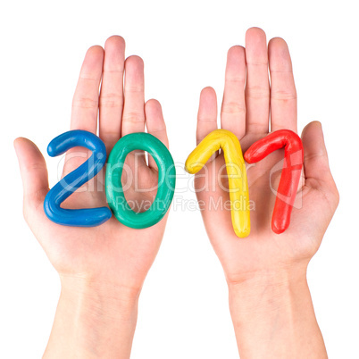 Hands with plasticine figures