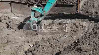 Excavator digging a trench