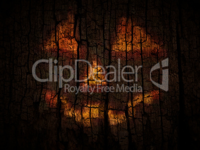 Reflection of Jack O Lantern on the old wood