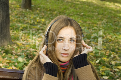 Girl with headphones fall